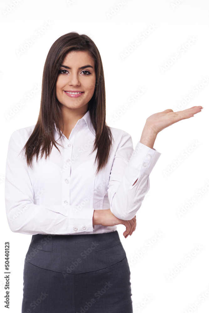 Young businesswoman showing something Young businesswoman showing something