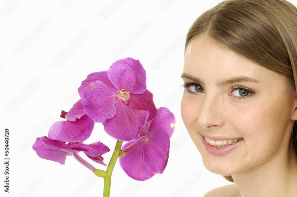 Young girl with beautiful makeup and pink orchids. Young girl with beautiful makeup and pink orchids.