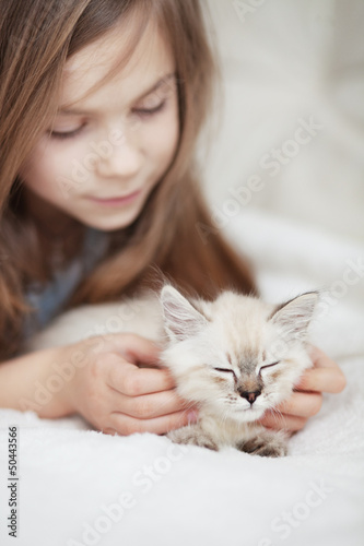 Child and kitten