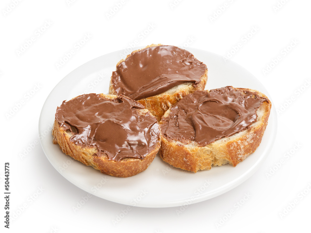 baguette slices spread with nut-choco paste on plate
