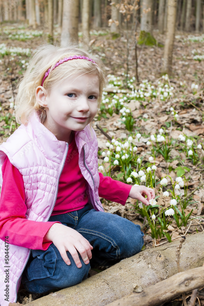 little girl with snowflakes in spring nature little girl with snowflakes in spring nature