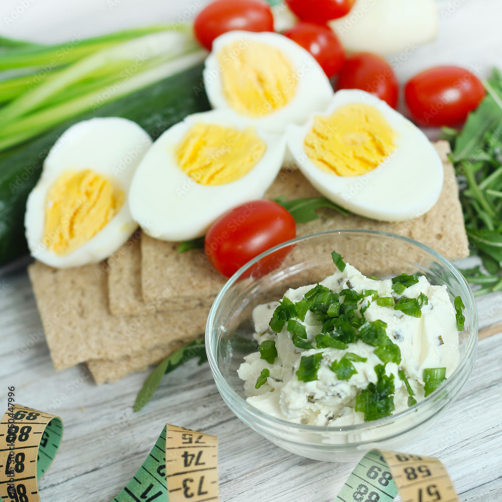 Fresh cream cheese spread in small bowl with chives on top Fresh cream cheese spread in small bowl with chives on top