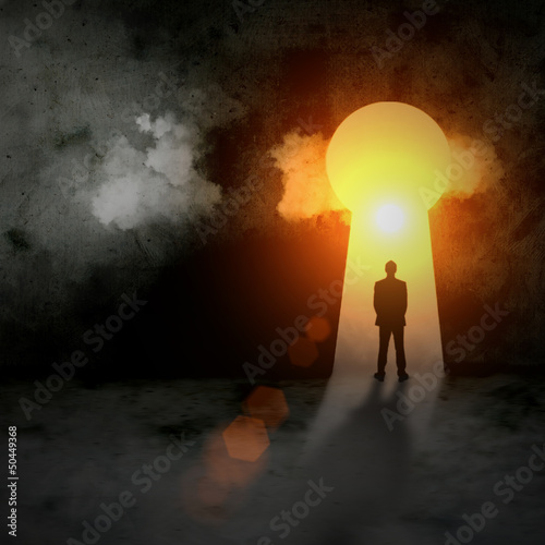 Silhouette of businessman in keyhole
