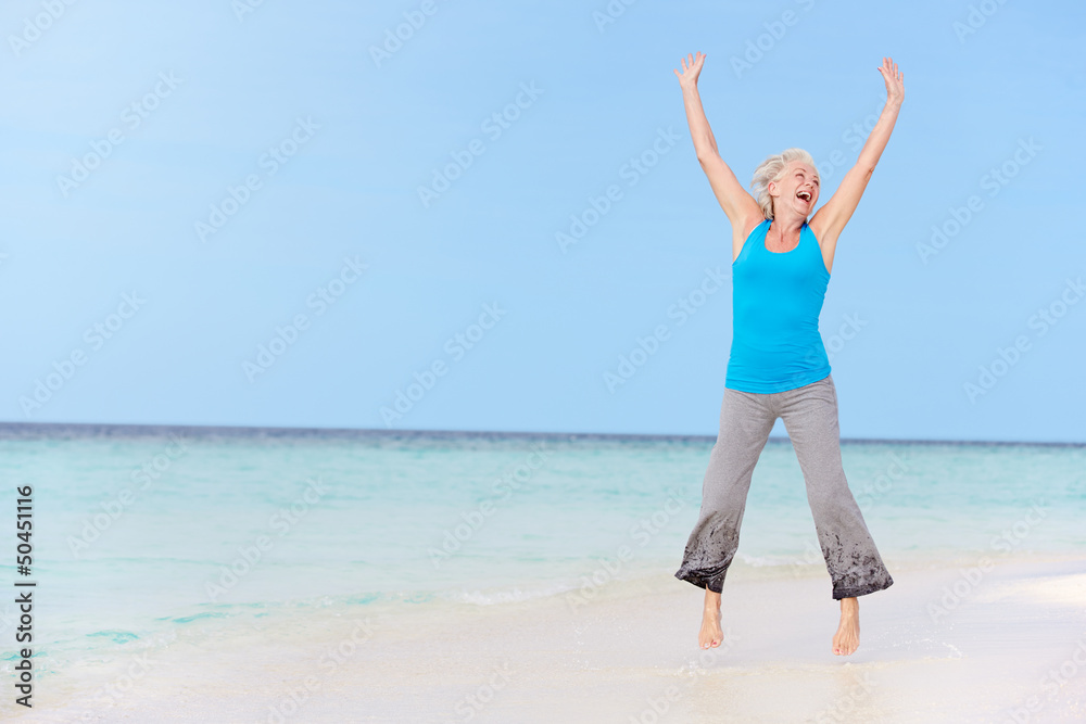 Senior Woman Jumping On Beautiful Beach Senior Woman Jumping On Beautiful Beach
