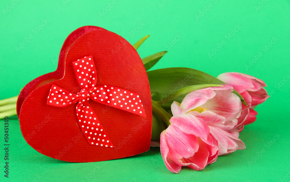 Pink tulips and gift box, on color background Pink tulips and gift box, on color background