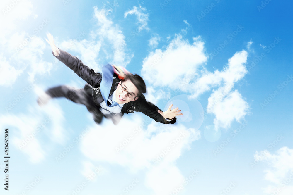 Young businessman flying with parachute on back Young businessman flying with parachute on back