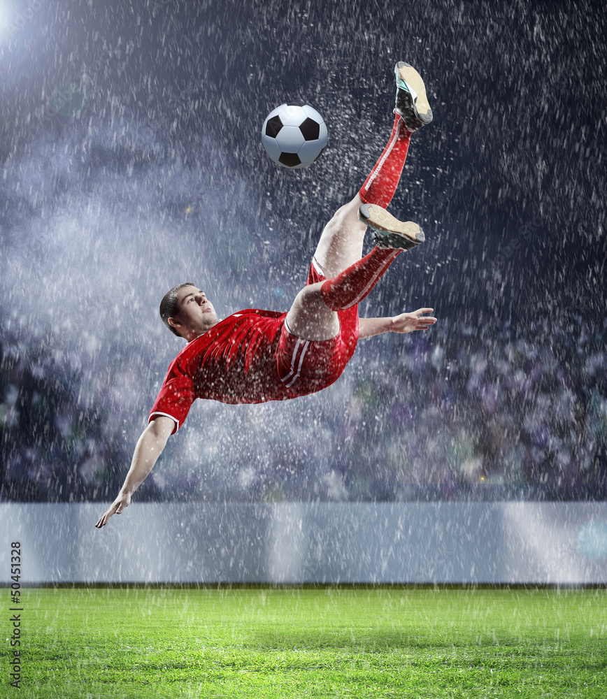football player striking the ball football player striking the ball