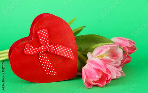 Fototapeta Naklejka Na Ścianę i Meble -  Pink tulips and gift box, on color background
