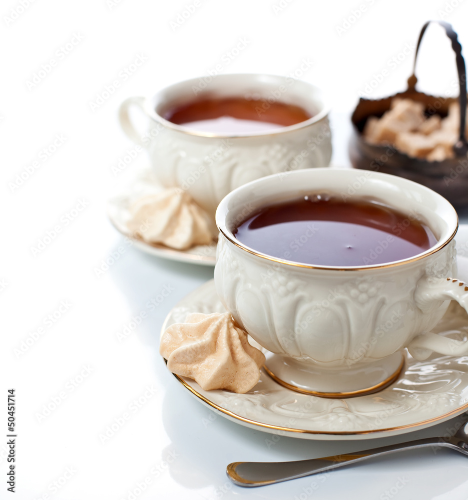 Elegant tea cups and freah meringues Elegant tea cups and freah meringues