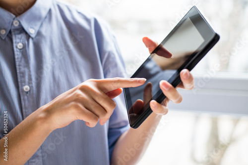 woman using digital tablet