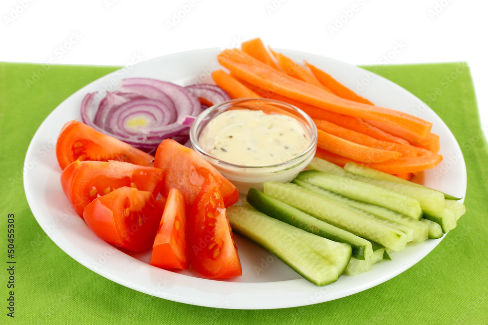 Assorted raw vegetables sticks in plate close up Assorted raw vegetables sticks in plate close up