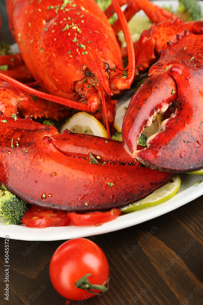 Red lobster on platter on table close-up Red lobster on platter on table close-up