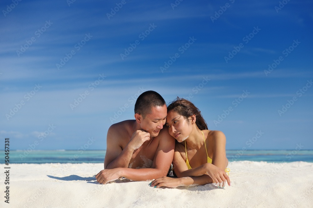 happy young couple enjoying summer on beach happy young couple enjoying summer on beach