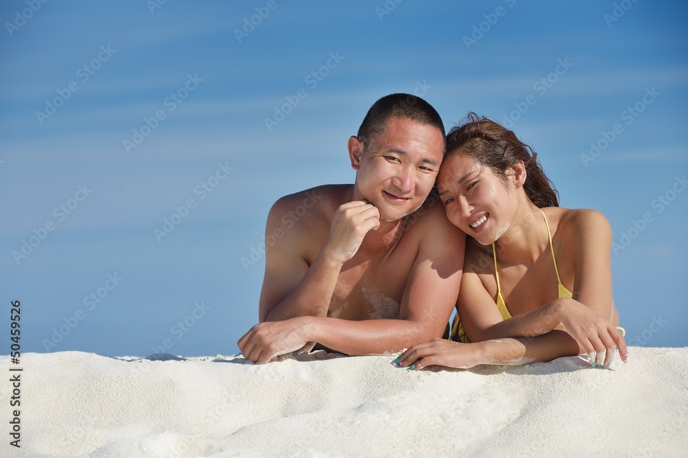 happy young couple enjoying summer on beach happy young couple enjoying summer on beach