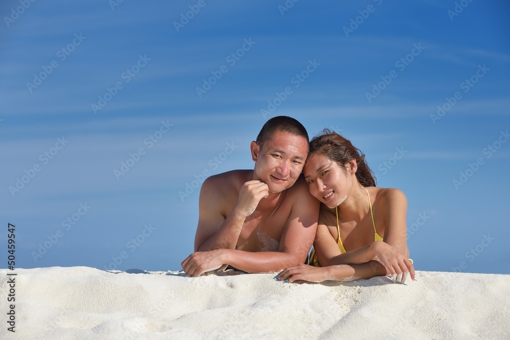 happy young couple enjoying summer on beach happy young couple enjoying summer on beach