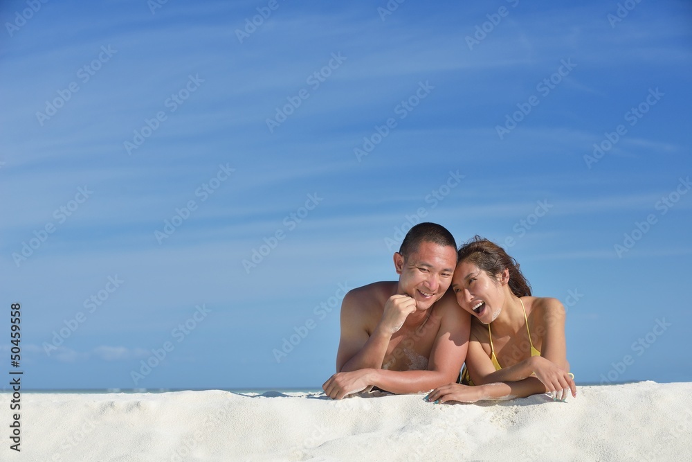happy young couple enjoying summer on beach happy young couple enjoying summer on beach