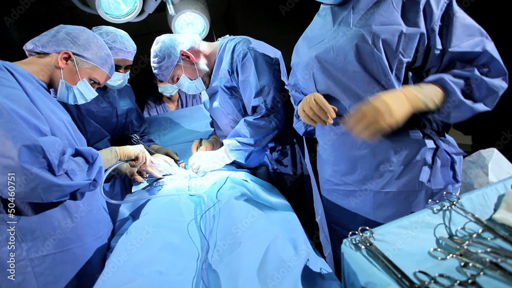 Specialized Team Performing Surgery in Operating Room Specialized Team Performing Surgery in Operating Room