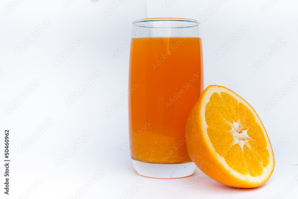 glass with orange juice and orange on a white background glass with orange juice and orange on a white background
