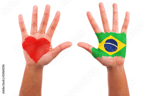 Brazilian hands with a painted heart and brazilian flag, i love