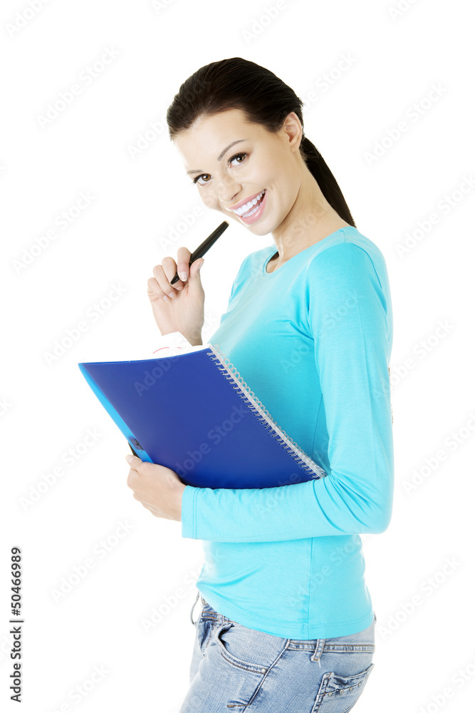 Happy student woman with notebook