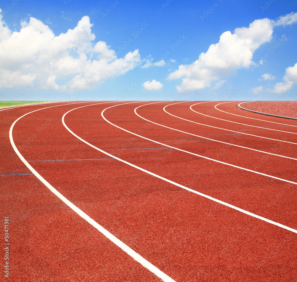 Fototapeta premium Running track with lanes over sky and clouds