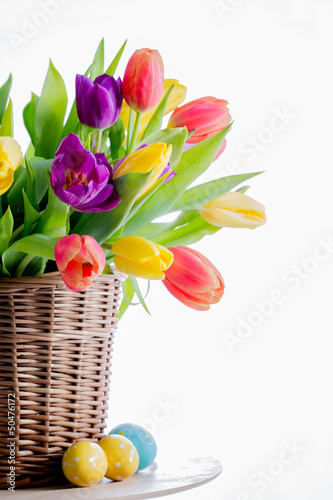 Easter. Fresh spring tulips flowers and Easter eggs