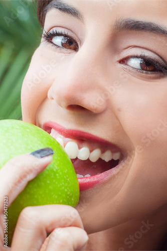 Closeup of woman eating an apple