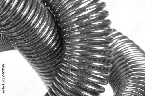 Coiled metal spring abstract background