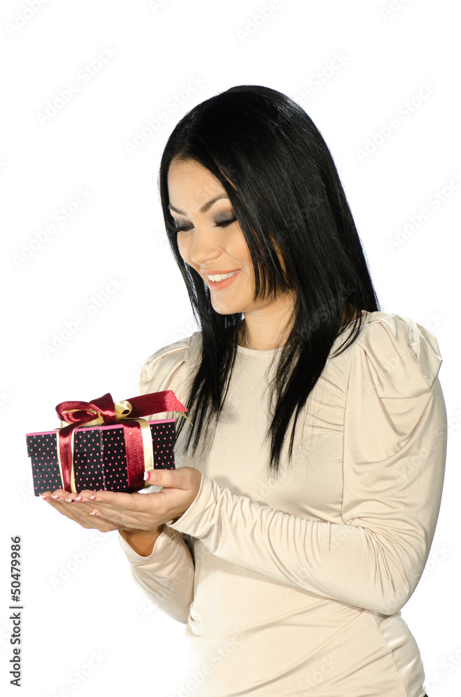 Beautiful brunette holding a present box Beautiful brunette holding a present box