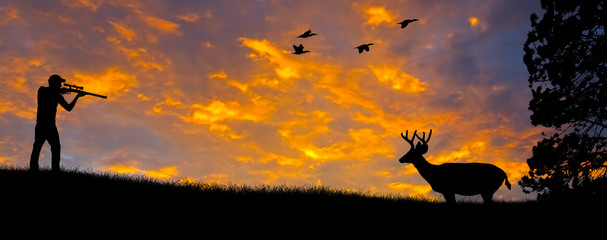 Papier peint photo Chasser Silhouette de chasseur au fusil  © photoexpert117