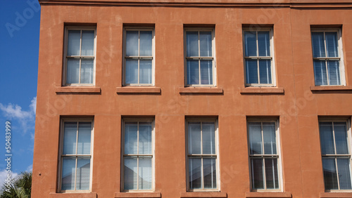 Windows in Old Red Stucco Building