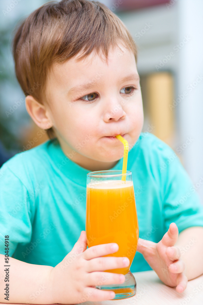 Little boy with glass of orange juice Little boy with glass of orange juice