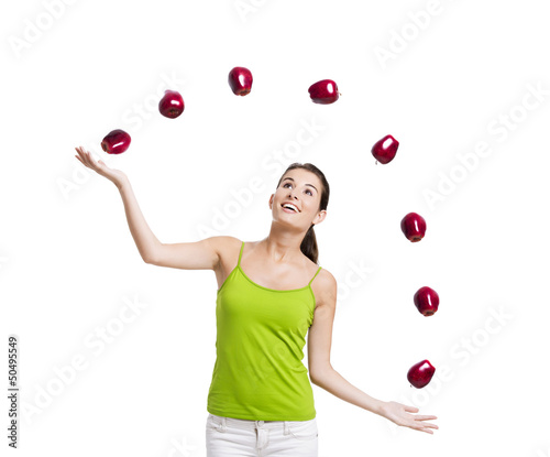 Woman throwing apples photo