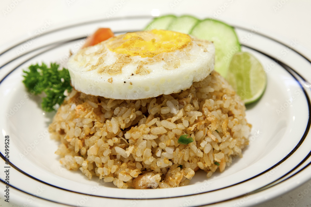 Salmon fried rice and egg on top