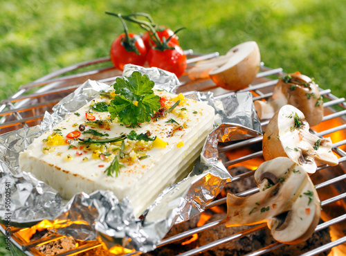 Halloumi or feta cheese on a barbecue