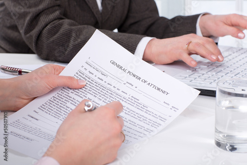 Hands of the woman signature document