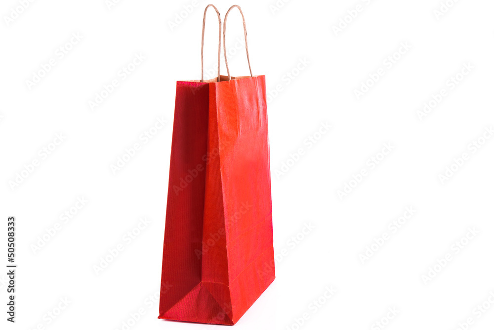 Red paper shopping bag isolated. Shopping concept.