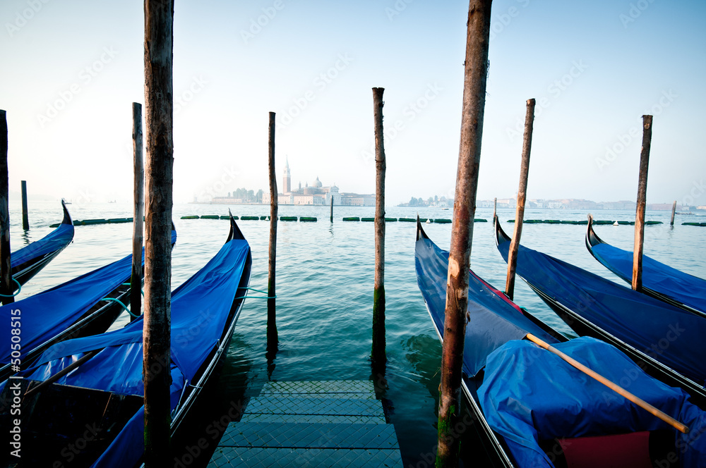 Gondolas moored by Saint Mark square, Venice, Italy