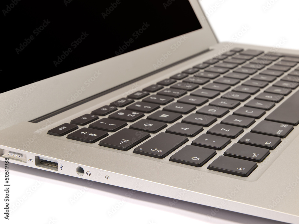 QWERTY Keyboard of a Modern Slim Laptop on White Background QWERTY Keyboard of a Modern Slim Laptop on White Background