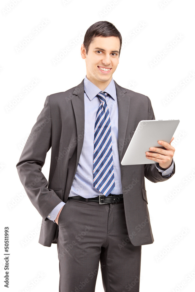 Smiling businessman holding a tablet