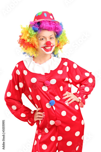 Smiling female clown in a red costume posing