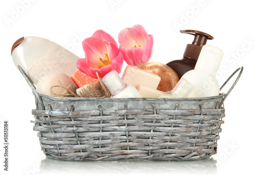 Fototapeta Naklejka Na Ścianę i Meble -  Composition of cosmetic bottles and soap in basket, isolated
