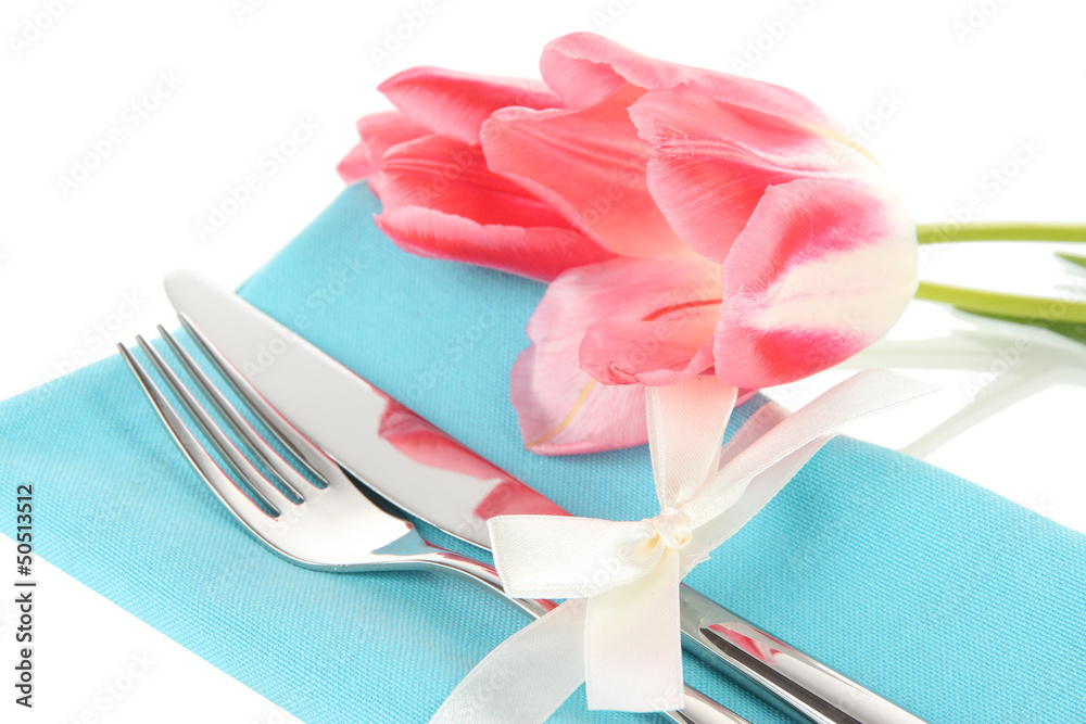 Festive dining table setting with tulips isolated on white Festive dining table setting with tulips isolated on white