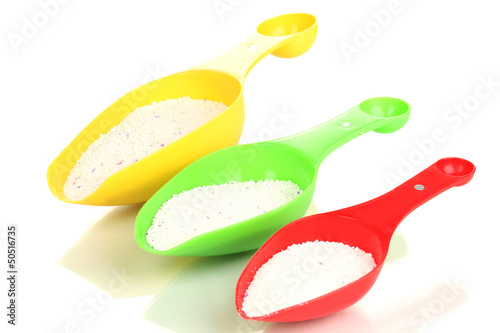 Washing powder in measuring cup isolated on white