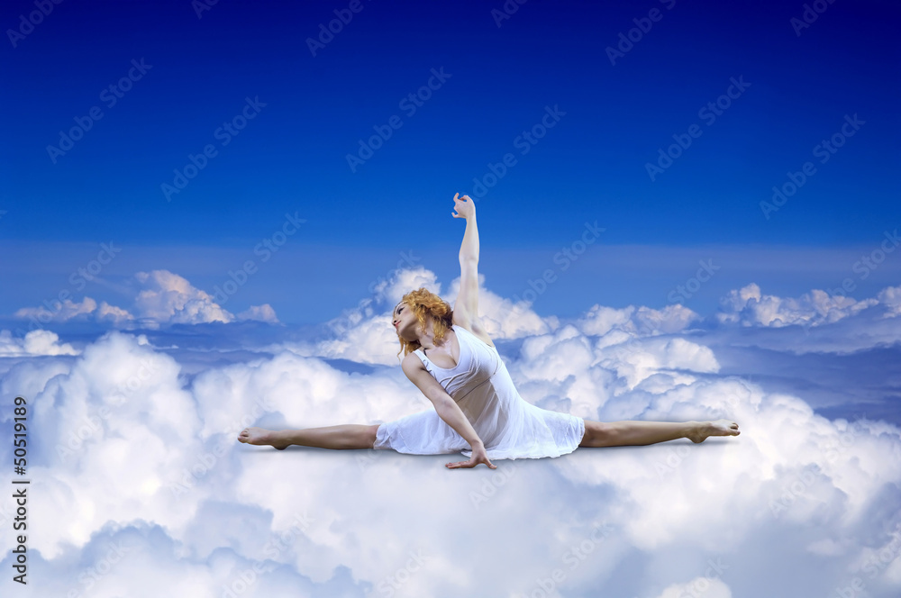 Ballerina seating on the sky clouds