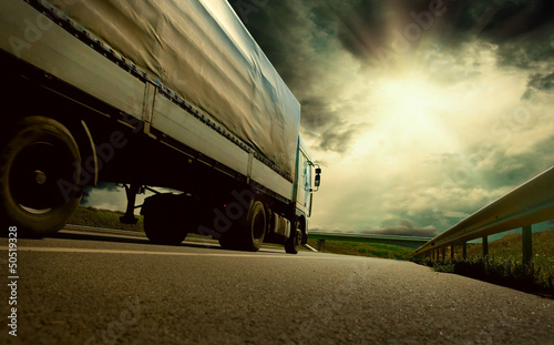 Beautiful view with truckcar on the road  under sky with clouds photo