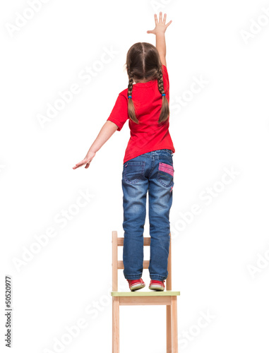 little girl wearing red t-shirt and reaching out something up hi