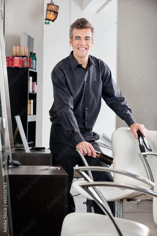 Happy Hairstylist Holding Straightener And Brush Happy Hairstylist Holding Straightener And Brush