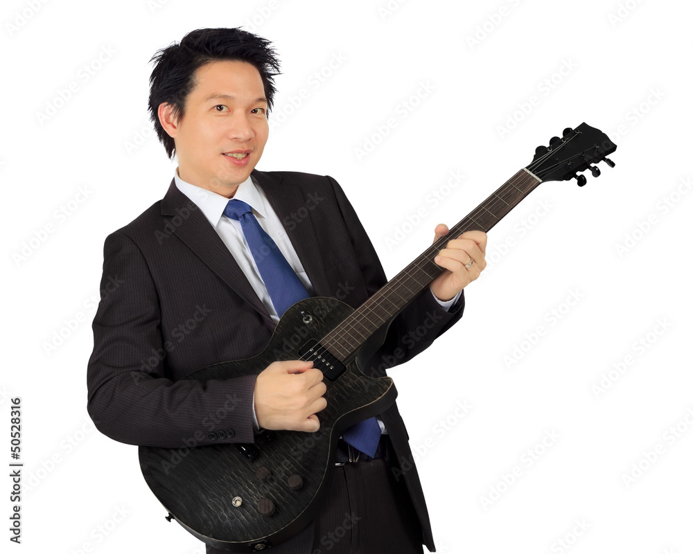 Obraz premium An asian male with a black electric guitar