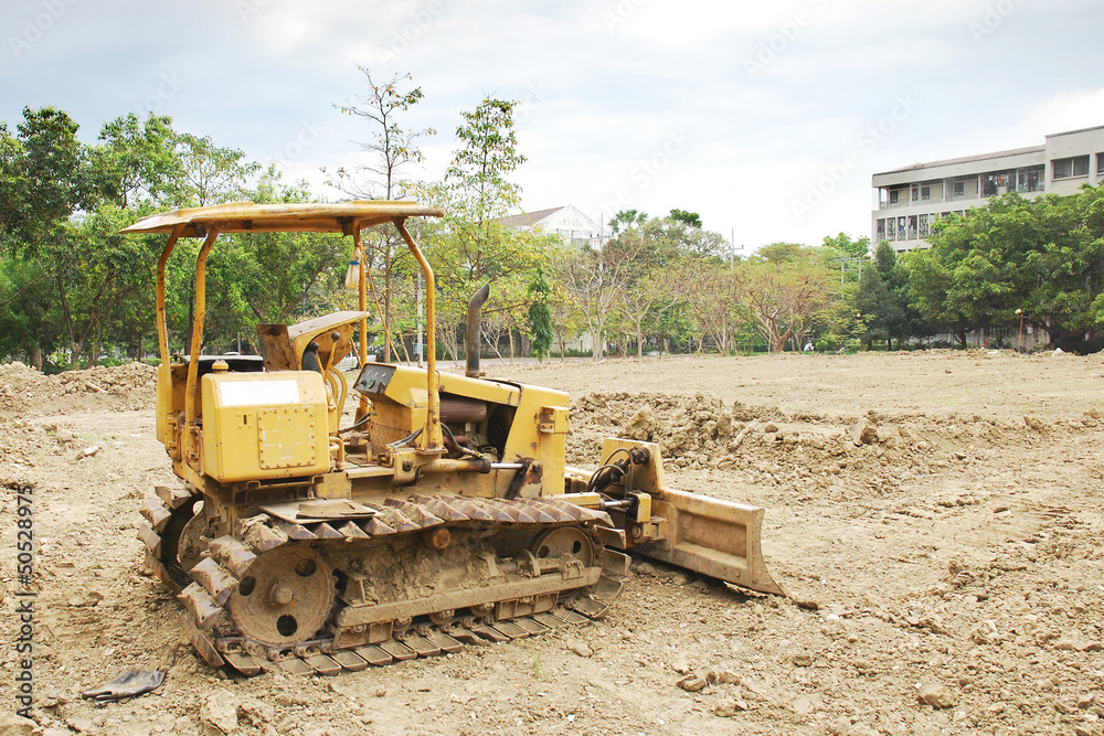 The bulldozer on a building site The bulldozer on a building site